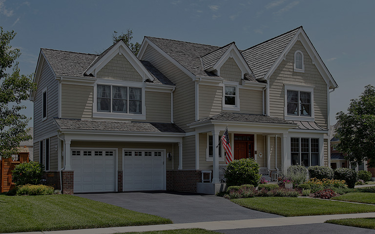 Suburban home with front porch and cedar roof
